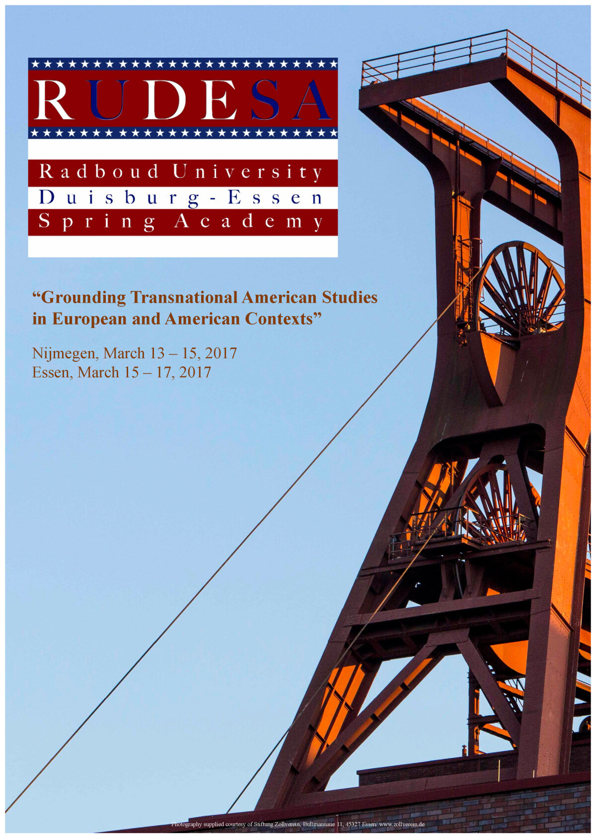 The picture shows the Zollverein shaft tower, a blue sky and the RUDESA Logo.