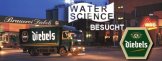 Schriftzug: Water Science besucht die Diebels-Brauerei. Ein LKW von Diebels fährt gerade aus der Lagerhalle der Brauerei heraus.