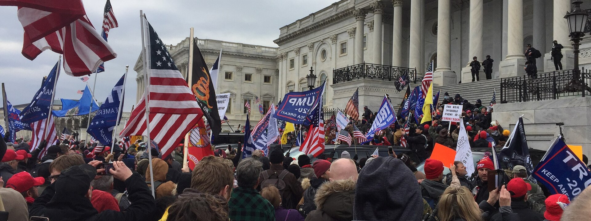 Crowd of Trump supporters marching on the US Capitol on 6 January 2021, ultimately leading the building being breached and several deaths.
