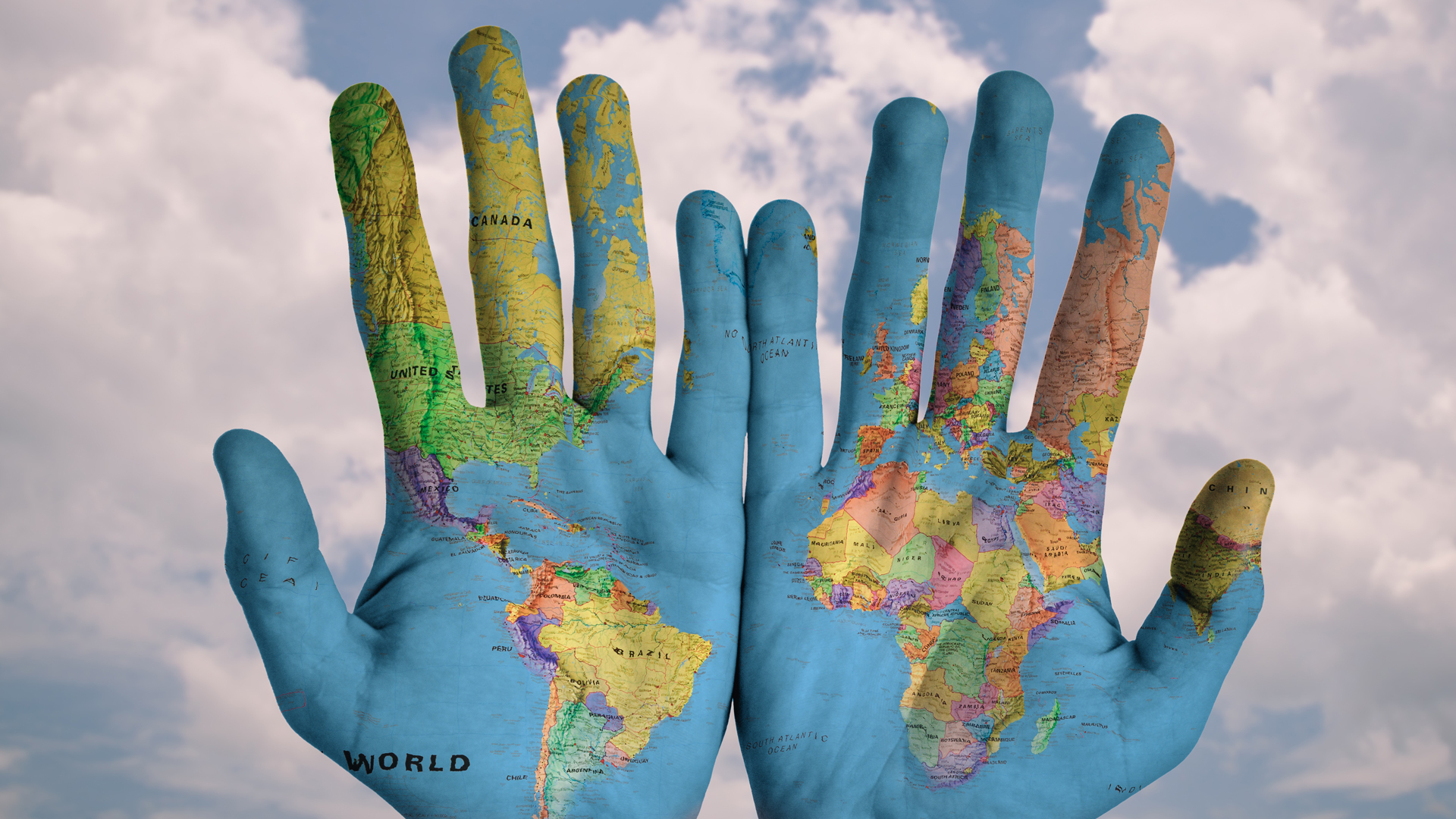Schmuckbild gemalte Weltkarte auf Händen